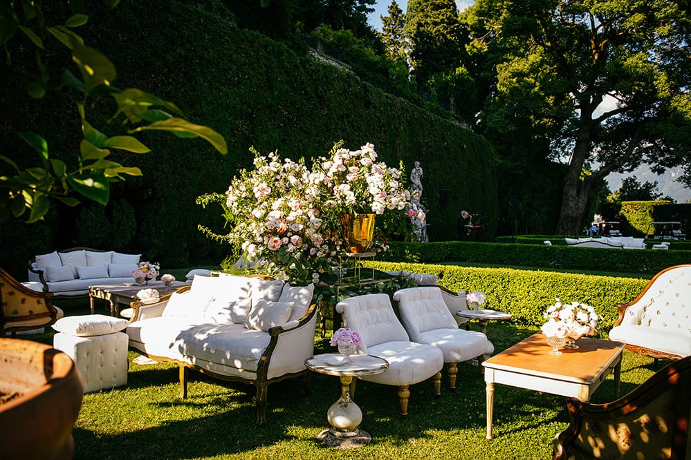 Outdoor seating area decorated with flowers