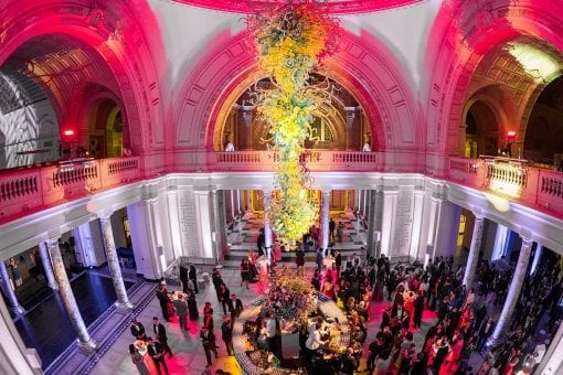 Guests enjoying a drinks reception in the Dome at the Victoria and Albert Museum for a luxurious wedding