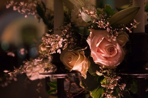 Close up of soft pink and cream roses for a wedding reception