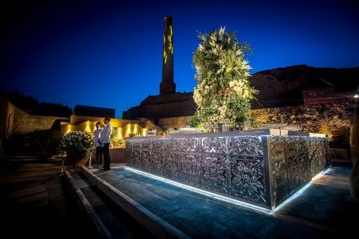 Bespoke silver square bar with an enormous floral centrepiece at a luxury destination wedding in Greece