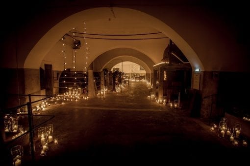 Walkway lit by thousands of candles in a luxury destination wedding in Santorini, Greece
