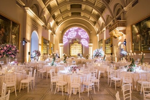 Wedding reception with stunning floral centrepieces at the Raphael Gallery at the Victoria and Albert Museum, London