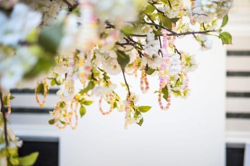 Sweets hanging from a tree in a fun and exciting way for a top wedding in London