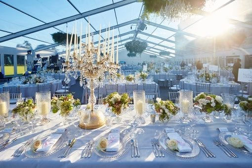 Floral hanging chandeliers, crystal candelabras and beautiful floral arrangements set for a luxury wedding at Blenheim Palace