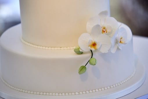 Beautiful orchid detailing on a stunning wedding cake