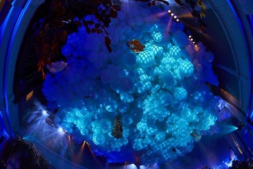 A ceiling covered in white balloons