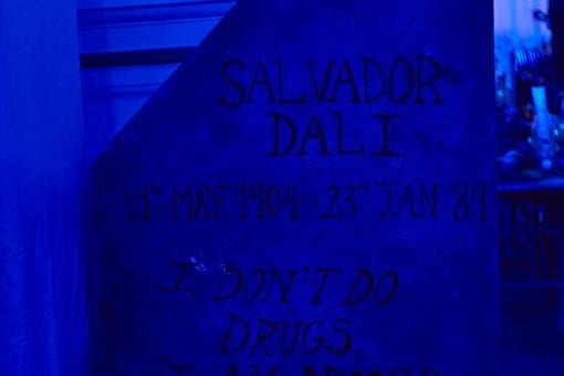 Set design quoting Salvador Dali written on a gravestone for a surrealist party at One Marylebone