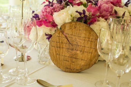Menu written on wood for a rustic countryside wedding in London