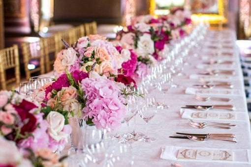 Stunning tablescape with pink and cream flowers at the Little Banqueting House at Hampton Court Palace