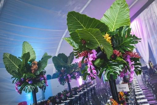 Green palms and purple flowers at an event at Battersea Power Station