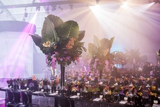 Beautiful trees and colourful flowers on long tables at Battersea Power Station event