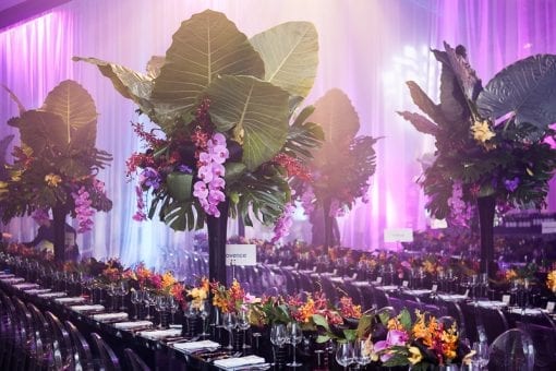 Exotic tablescape with palms and colourful florals at an luxury event in London