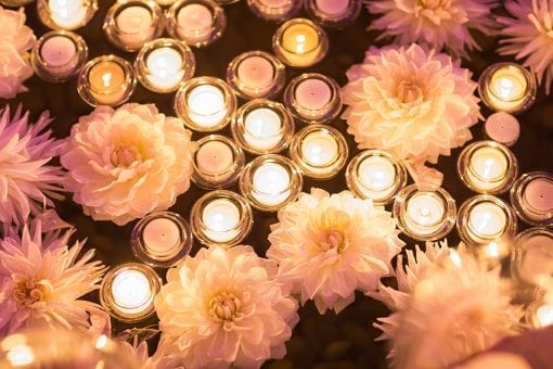 Floating candles and flowers in a water feature at a luxury wedding