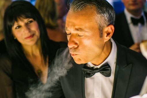 A guest experiencing entertaining desserts with dry ice at the Heron Tower in London