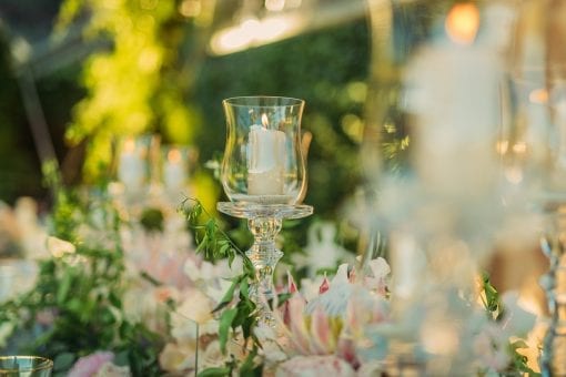 Detail of elegant candle on a table at stunning wedding ceremony for a destination wedding