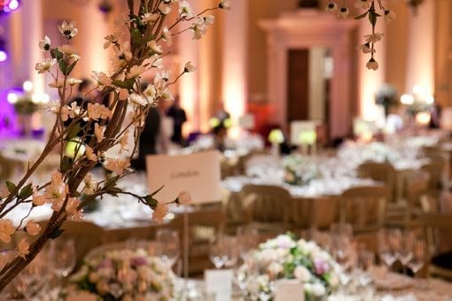 High society wedding held at the Banqueting House, London, filled with cherry blossom and flowers