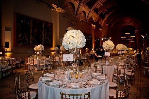 Tables set up for dinner at a luxury wedding reception