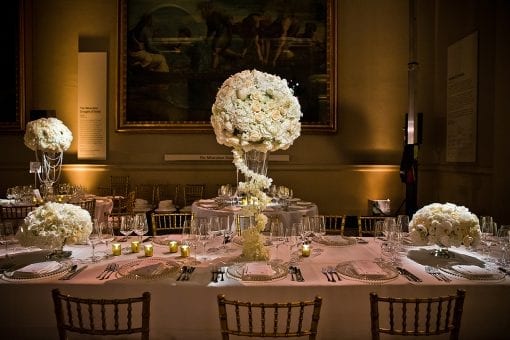 Luxury Royal Nigerian White Wedding Top Table with stunning white rose floral centrepieces in the Ralphael Gallery at the V&A