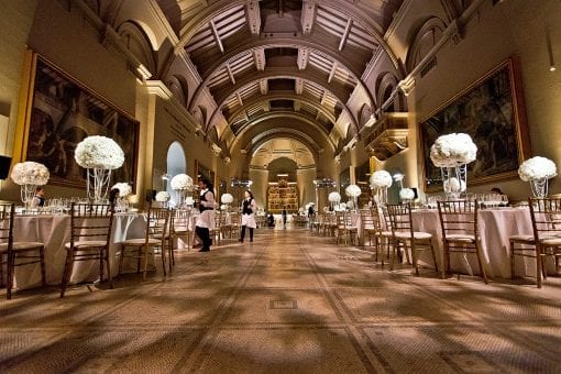 Tables set up for a wedding reception in the Ralphael Gallery at the Victoria & Albert Museum, London