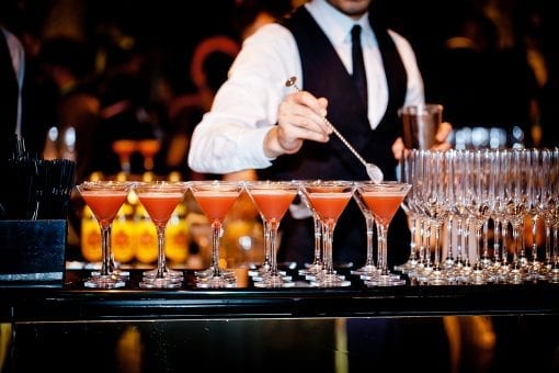 Barman mixing bespoke cocktails at a luxury wedding