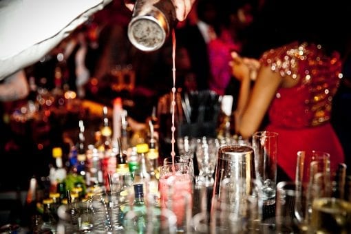Barman mixing cocktails at a luxury wedding in the Victoria and Albert Museum, London