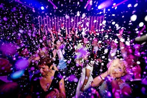 Confetti falling onto guests at a luxurious wedding party