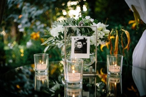 Beautifully elegant table set up with glass, mirror and natural pretty flowers at a private estate