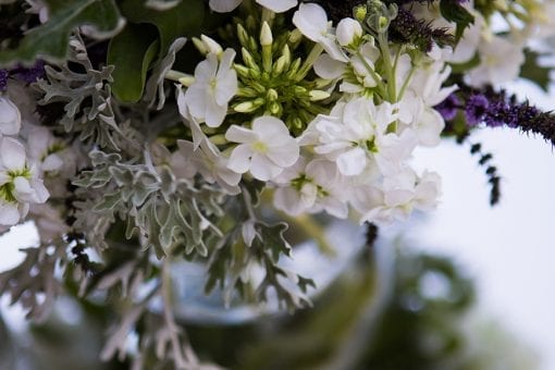 Elegant floral arrangements with soft purples and whites at a private event