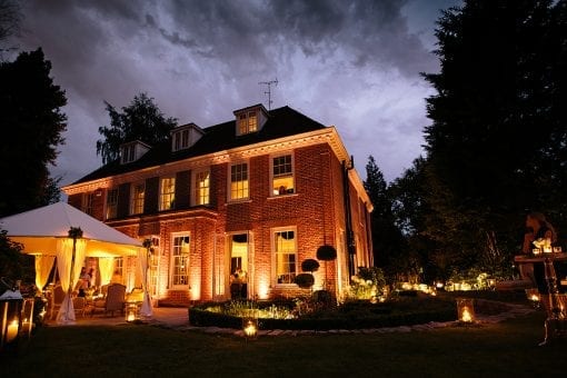 A private estate lit up at night for a private party