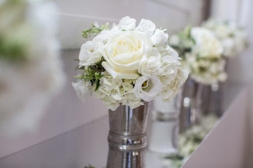 White bouquet of flowers in a silver vessel for a private event