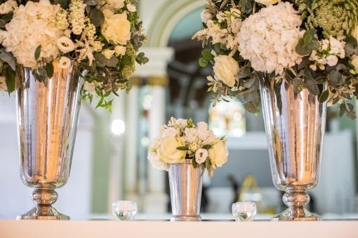 Beautiful silver vases with elegant white and green flowers creating an elegant and pretty look at One Marylebone