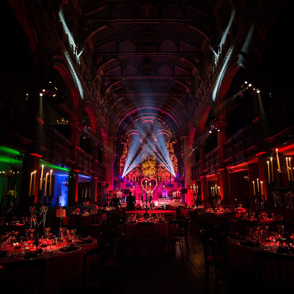 A Moulin Rouge themed birthday party with set design, lighting design and table set up, in a London venue