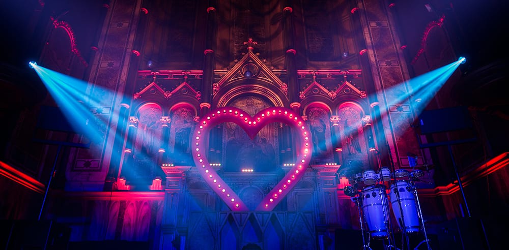 Large illuminated heart installation inside a private birthday party at a London venue for a Moulin Rouge themed event