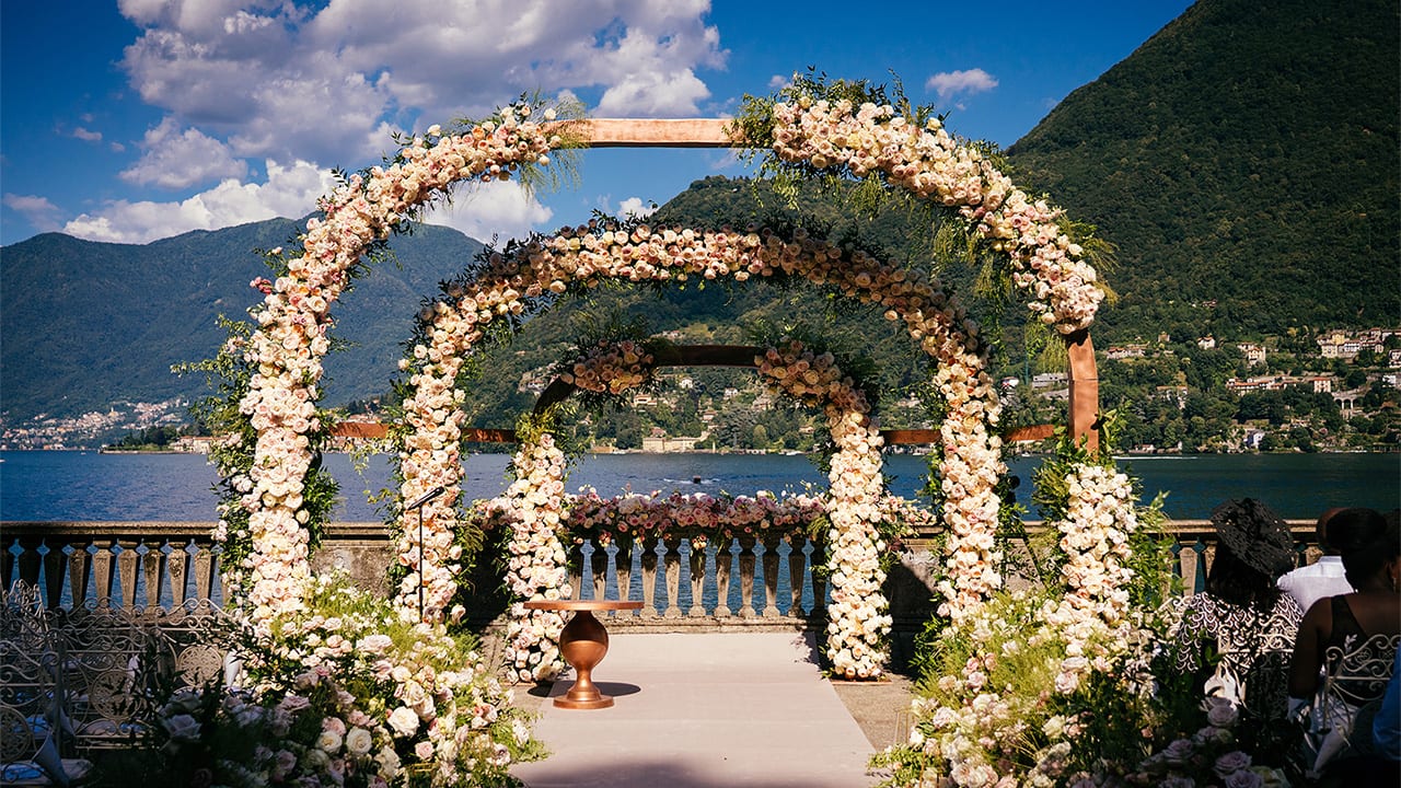 Stunning floral bespoke wedding arches overlooking Lake Como, at Villa Pizzo in Italy