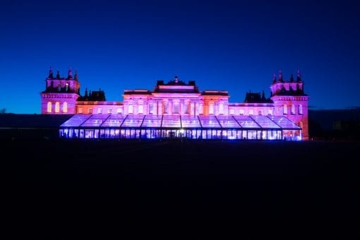 Large glass structure / marquee built for a large luxury Indian wedding at Blenheim Palace in Oxfordshire, England, UK at night