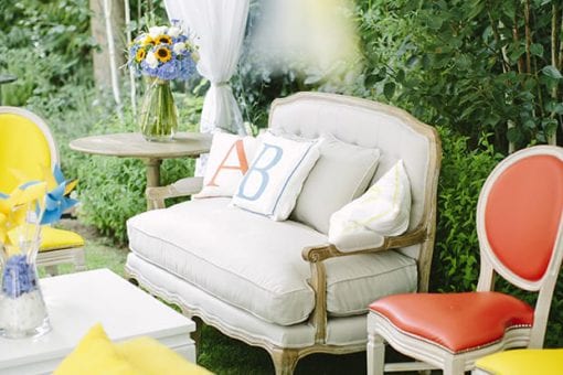 Colourful soft seating under a Raj tent for a 1st birthday party in London