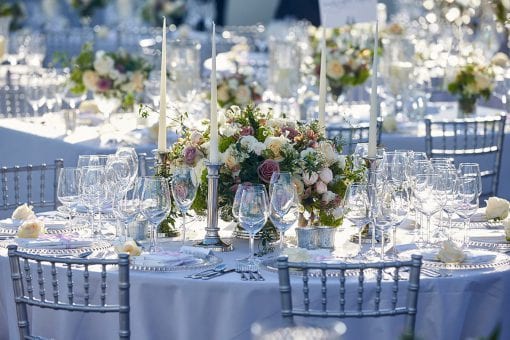 Stunning floral table centrepieces with crystal vases for a luxury wedding at Blenheim Palace