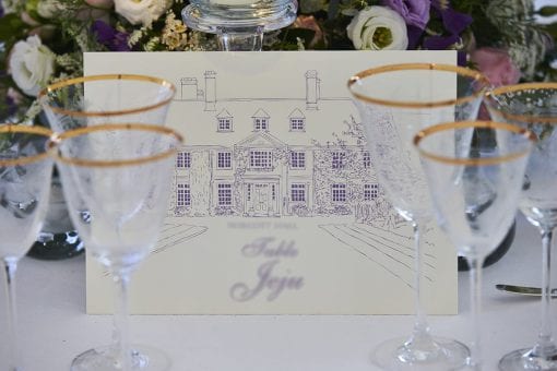 Luxury wedding reception with beautiful hand illustrations on table numbers