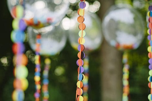 Transparent balloons with colourful confetti string handles