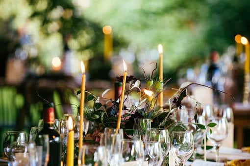 Beautiful English country wedding with candles and foliage
