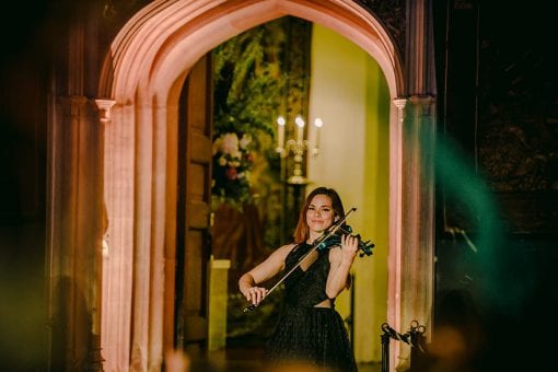 Violinist performing at Hampton Court Palace for a luxury birthday party