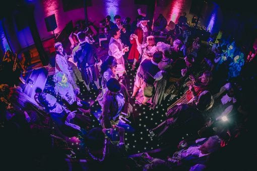 Dancing on a black pinspot dance floor at Hampton Court Palace