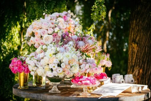 Large bouquets of fresh colourful flowers at high end wedding in Lake Como, Italy