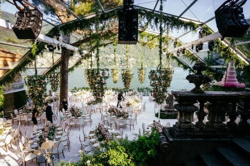 Stunning wedding reception styled with fresh flowers overlooking exciting wedding destination at Villa Pizzo in Lake Como