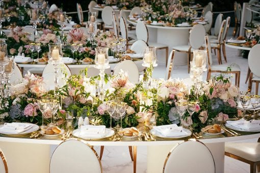 Opulent florals on bespoke mirrored tables for wedding reception in Villa Pizzo in Lake Como Italy for a luxury Nigerian white wedding