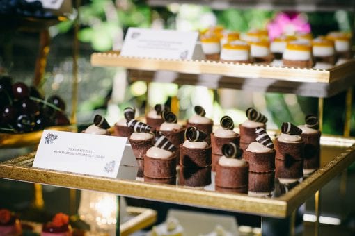 Delicate chocolate tarts with hazelnut Chantilly cream served at a luxury wedding in Lake Como, Italy
