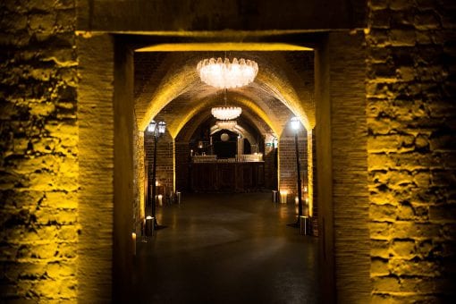 An underground cellar dressed for a Parisian alleyway event