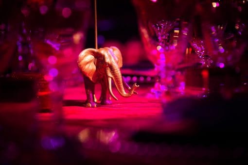 Bespoke gold elephant table name holder at a lavish private event in London